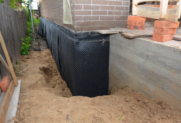 Happy homeowners after waterproofing job in Zieglerville